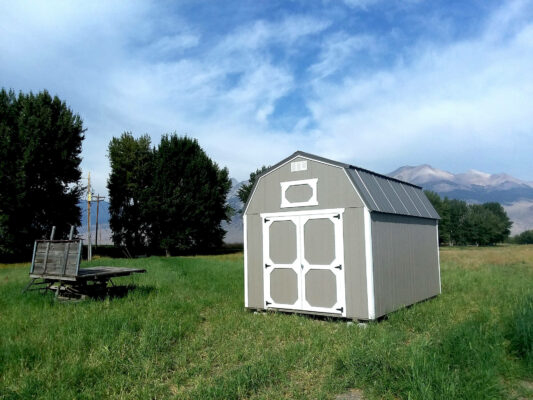 Lofted Barn 10x20, Double Barn Doors, Pewter Cast Siding, and Charcoal Metal Roof.